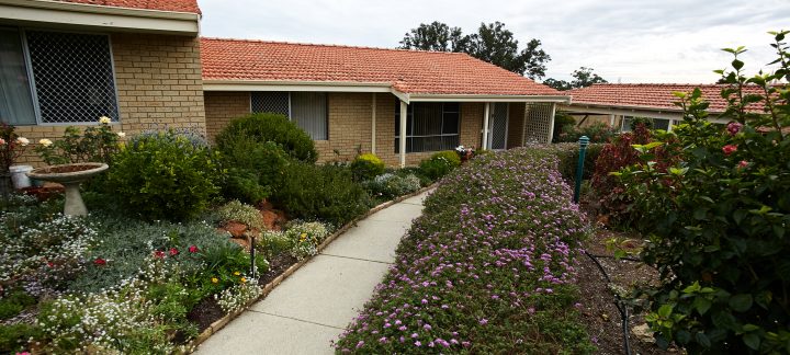 Front view of Villa Maria with greenery