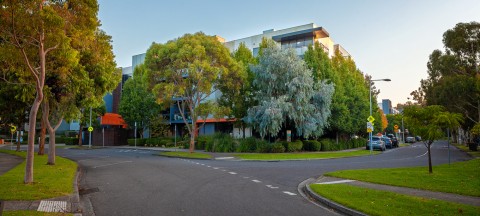 Exterior view of Mercy Place Parkville surrounded by lush green trees