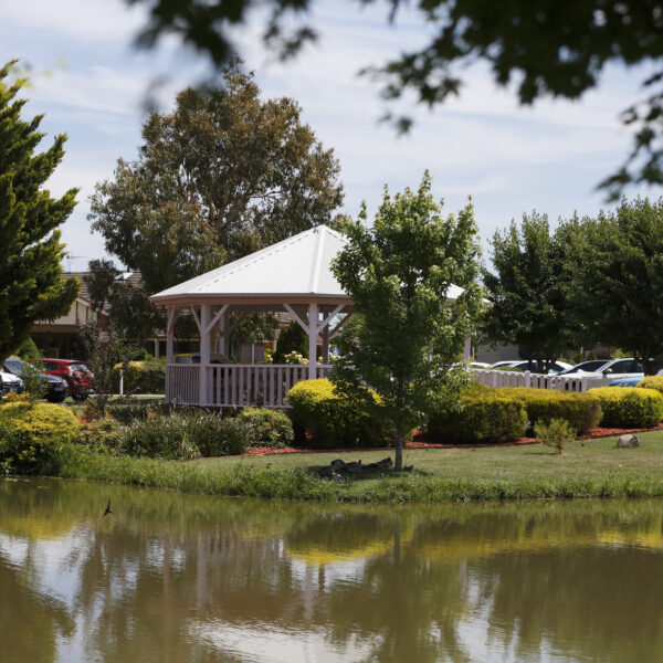 Lake at Shepparton Independent Living Units with surrounding trees and greenery reflecting in the water