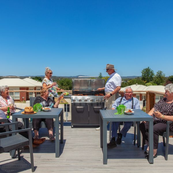 Residents enjoying the Community hub BBQ area at Golden Rise retirement Bendigo
