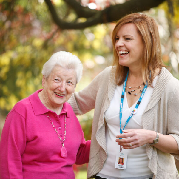 Smiling resident and worker at Mercy Health Wesley Grange Retirement Village